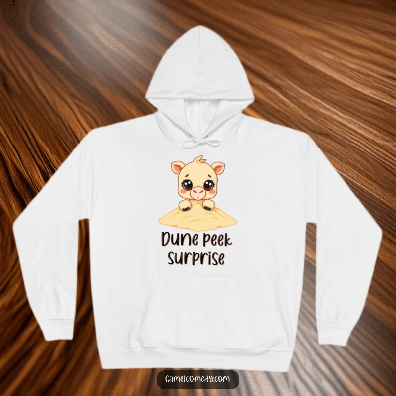 Funny Kawaii Camel Hoodie: a super cute camel with big round eyes peeks over a sand dune, offering a funny and cozy vibe.