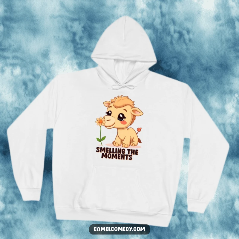 Funny Hoodie: A curious camel with a wide smile is illustrated sniffing a delicate desert flower.