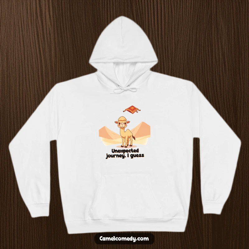 Kawaii camel looking surprised by a flying carpet against desert dunes, depicted on a warm hoodie, radiating magical adventure.