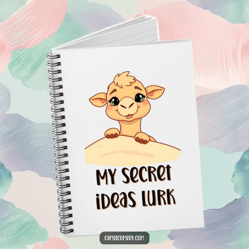 Funny notebook featuring a camel with a goofy grin peeking from behind a sand dune, ready for jotting down playful ideas.