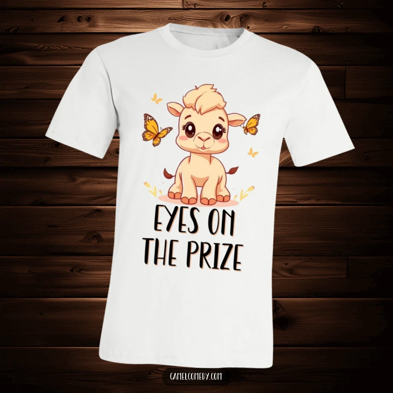 Funny t-shirt featuring a cute camel with wide eyes joyfully chasing a butterfly, embodying playful nature exploration and humor.